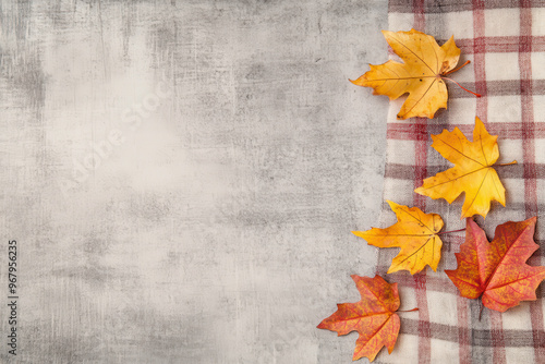 Autumn leaves on a table with room for text