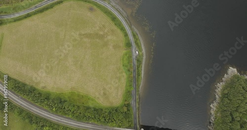 Aerial view of Loch Creran with lush green fields and a winding road, Oban, Scotland. photo