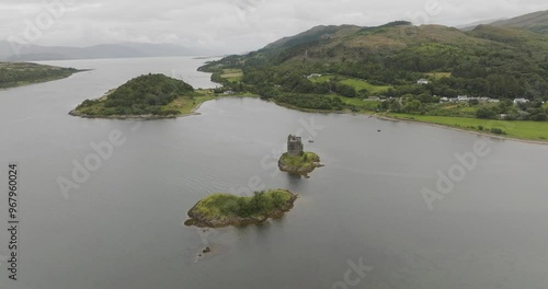 Aerial view of castle stalker on a serene island surrounded by loch linnhe and majestic hills, Appin, United Kingdom. photo