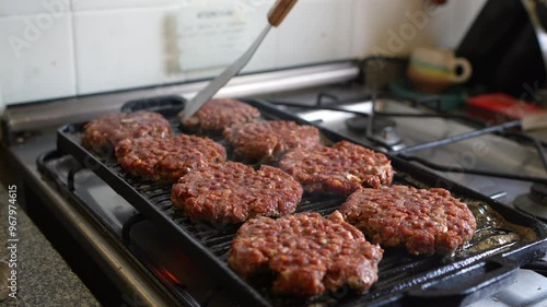 cooking smash burgers on the restaurant  photo