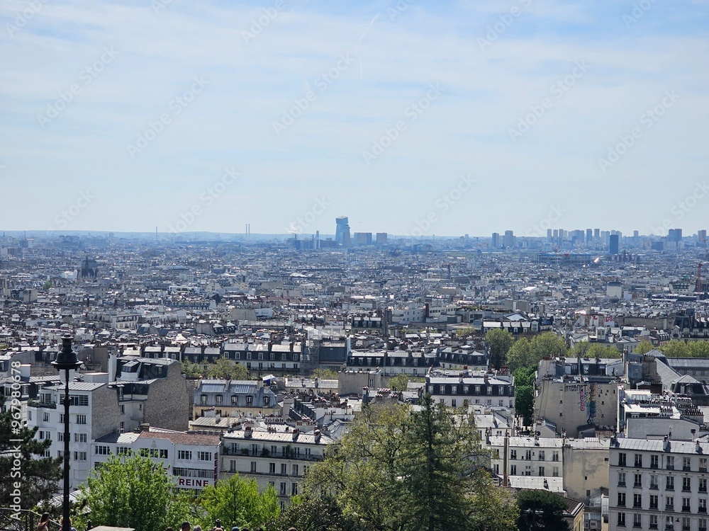 PARIS, FRANCE - April 13, 2024: Paris aerial panorama view from the steps of Sacre Coeur church at the top of Monmatre PARIS, FRANCE - April 13, 2024: Paris aerial panorama view from the steps of Sacre Coeur church at the top of Monmatre