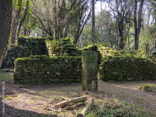 old stone grave with grass