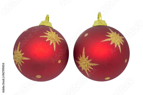 Two red balloons with gold stars on the tree. Two red Christmas tree decorations. Christmas tree decoration