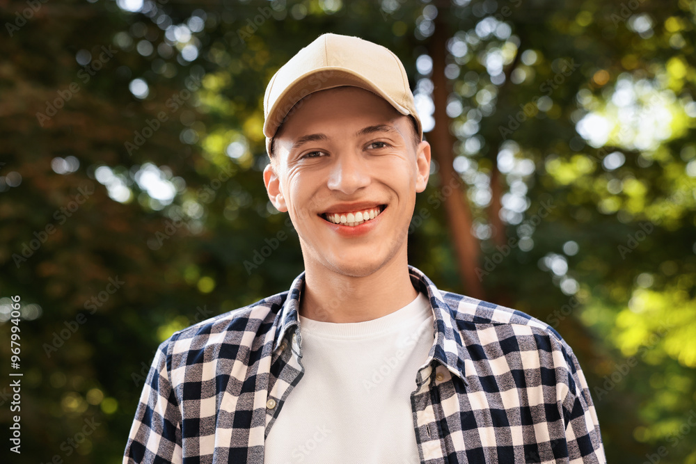 Portrait of smiling man in baseball cap outdoors Portrait of smiling man in baseball cap outdoors