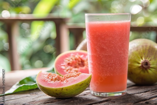 Colorful fruits on table, fresh juice with ice cubes. photo