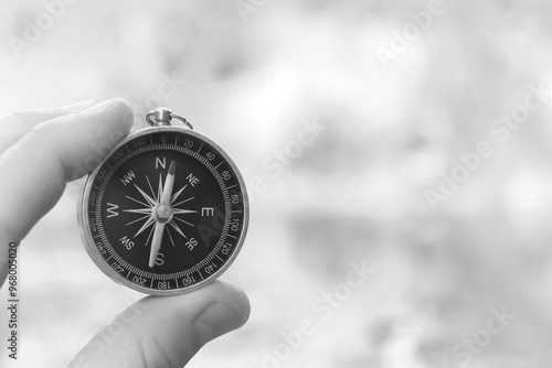 Classic navigation compass on natural background