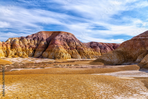 Akzhar Ulytau chalk mountains in the desert of Kazakhstan. Rare sandy hills with many multi-colored layers of clay, sand, chalk and gravel of bizarre shape far from civilization with sparse vegetation
