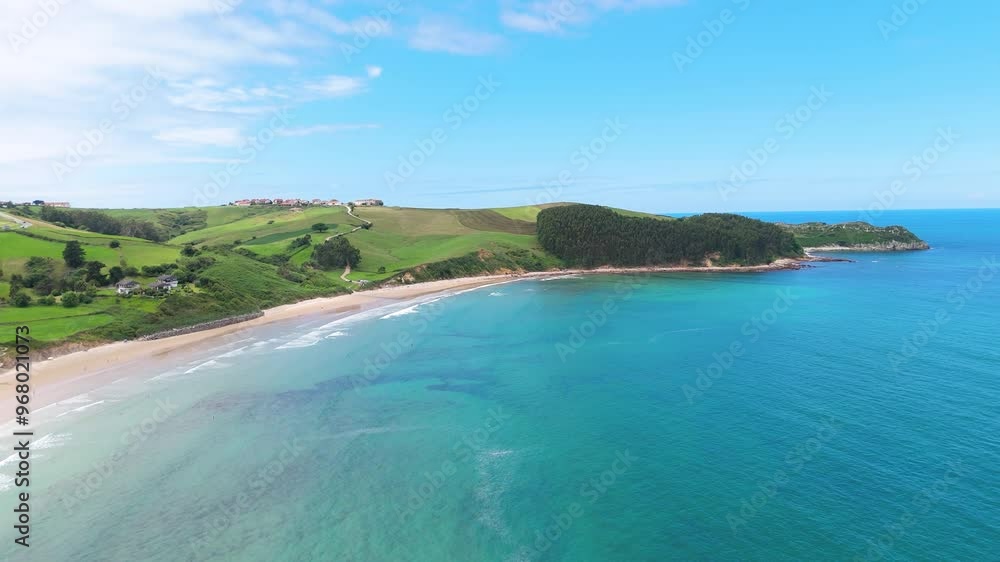 Aerial drone view of surfers surfing at Playa Oyambre at the Cantabrian Sea, San Vincente, Spain Aerial drone view of surfers surfing at Playa Oyambre at the Cantabrian Sea, San Vincente, Spain