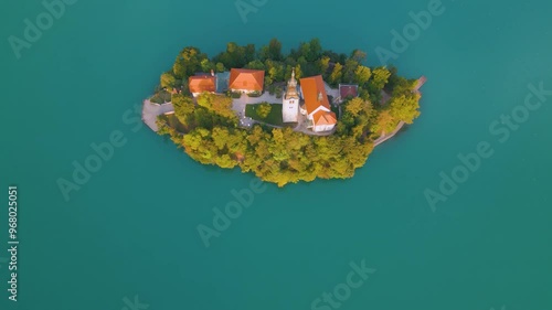 Aerial drone view of Lake Bled with famous church on the island during sunrise, Slovenia