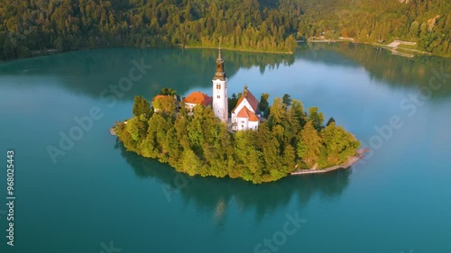 Aerial drone view of Lake Bled with famous church on the island during sunrise, Slovenia
