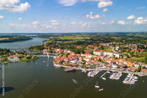 Fototapeta Naklejka Na Ścianę i Meble -  Drone shot of Lake Mikolajki in Masuria in summer, highlighting the vibrant landscape and clear waters.