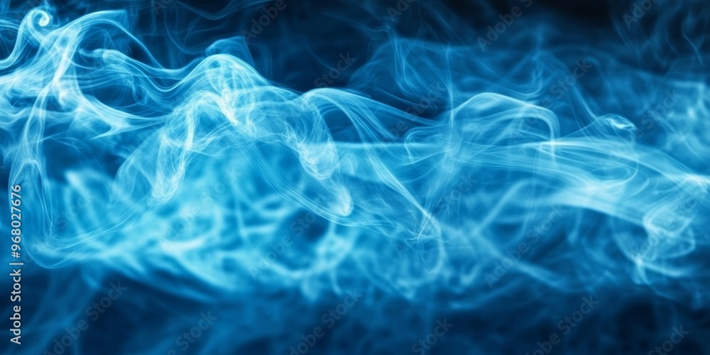 Fototapeta premium Swirling blue smoke dances in the dark, forming an enchanting abstract display that captivates the imagination