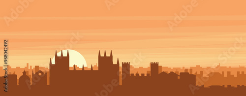 Brown panoramic poster of the city skyline with misty background buildings, sunrise, clouds and mountains of CANTERBURY, UNITED KINGDOM