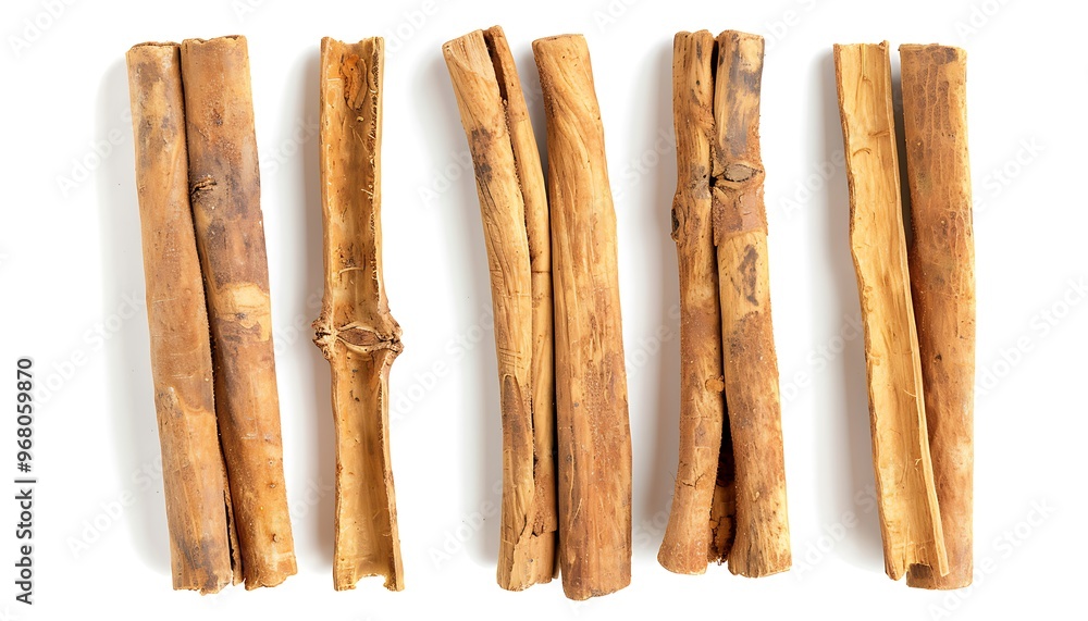 A pile of cinnamon sticks isolated on white background A pile of cinnamon sticks isolated on white background