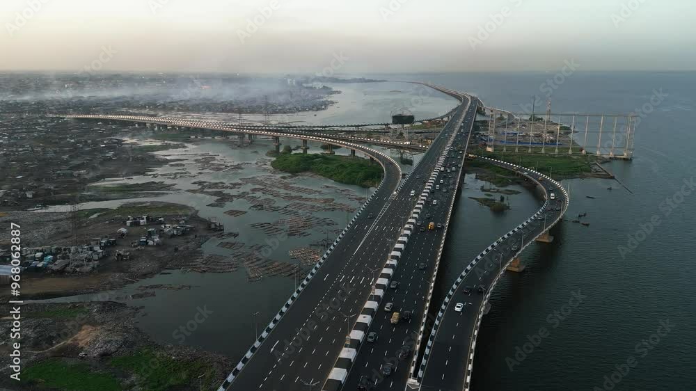 Aerial view of bustling Lagos Island with a sprawling bridge and busy roads over water, Lagos, Nigeria. Aerial view of bustling Lagos Island with a sprawling bridge and busy roads over water, Lagos, Nigeria.