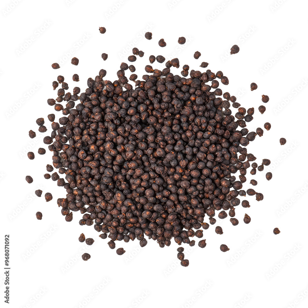 Close-up of a pile of black peppercorns, scattered against a dark background. Close-up of a pile of black peppercorns, scattered against a dark background.