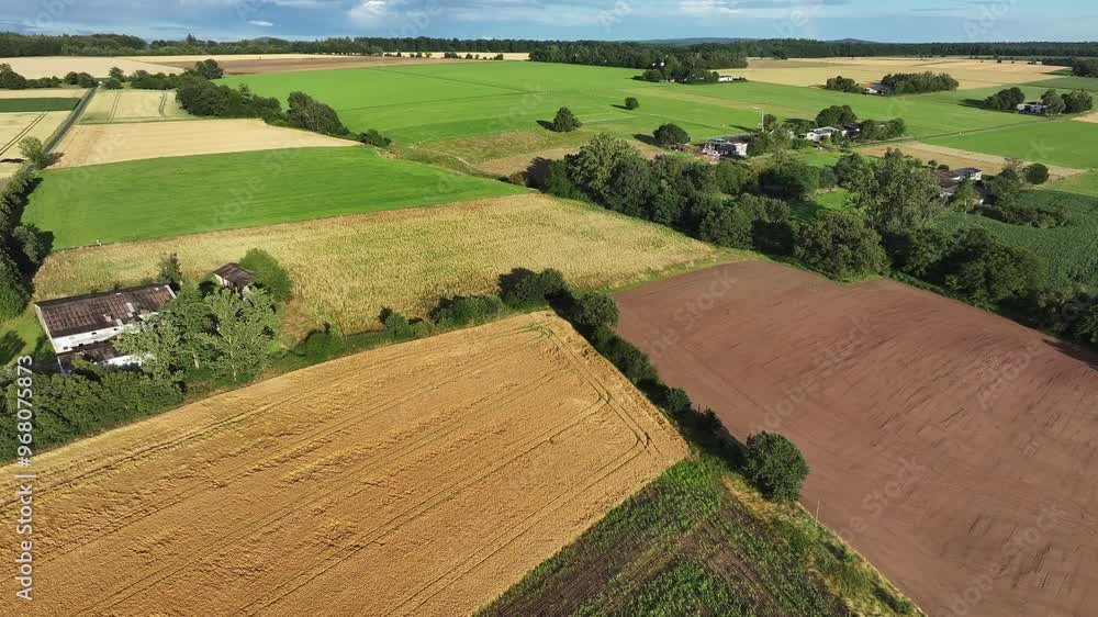 Aerial view of Humme village surrounded by lush green fields and tranquil farmland patterns, Hofgeismar, Germany. Aerial view of Humme village surrounded by lush green fields and tranquil farmland patterns, Hofgeismar, Germany.