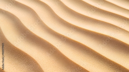 A close-up of rippled sand patterns in the desert, showcasing intricate textures against a light solid color background