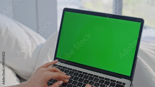 Wallpaper Mural Freelancer typing green screen laptop in bed morning home closeup. Woman hands Torontodigital.ca