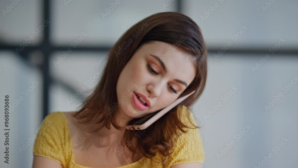 Smiling student calling mobile phone sitting at contemporary home space closeup Smiling student calling mobile phone sitting at contemporary home space closeup