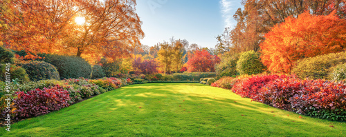 Beautiful English garden in the autumn with colourful trees and bushes. Panoramic view.