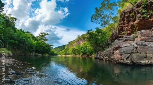 Serene River Flowing Through Lush Green Valley