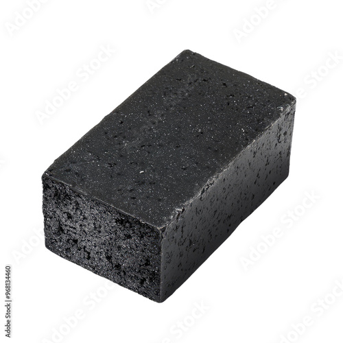 A close-up of a black charcoal soap bar, perfect for a deep clean.