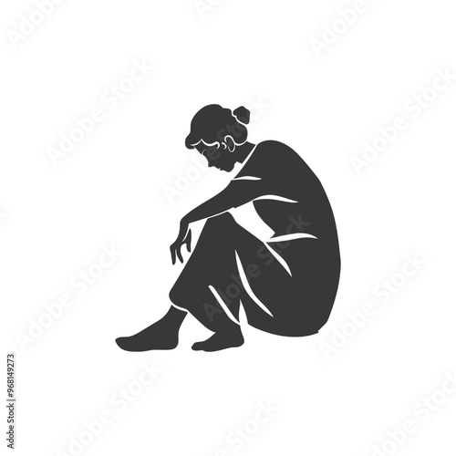 Silhouette of a woman sitting with head down