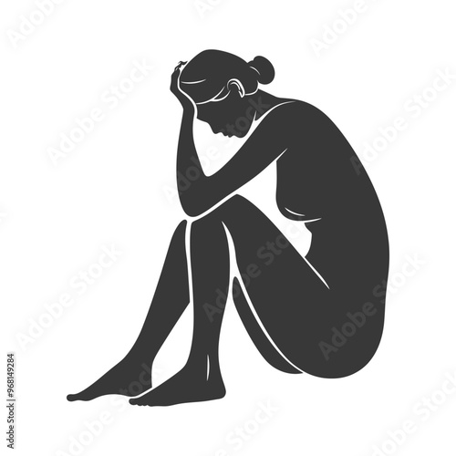 Silhouette of a Woman Sitting with Her Head in Her Hands