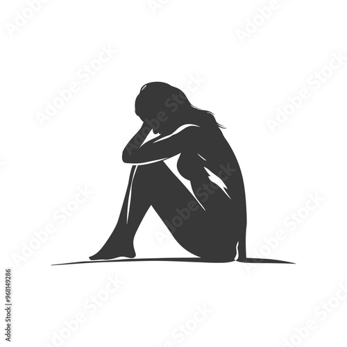 Silhouette of a Woman Sitting with Her Head in Her Hands