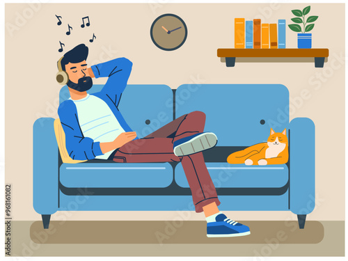 Dude chilling on a sofa listening to music on headphones next to a cat