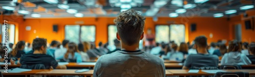 Man sitting in front of a classroom full of students