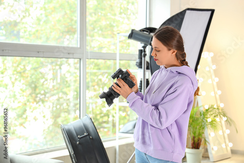 Female photographer with ca...