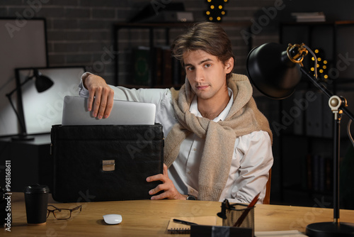 Young businessman putting l...