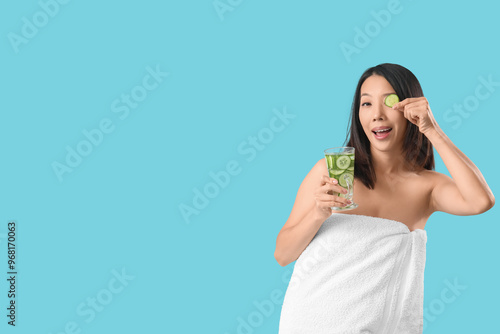 Young Asian woman with glas...