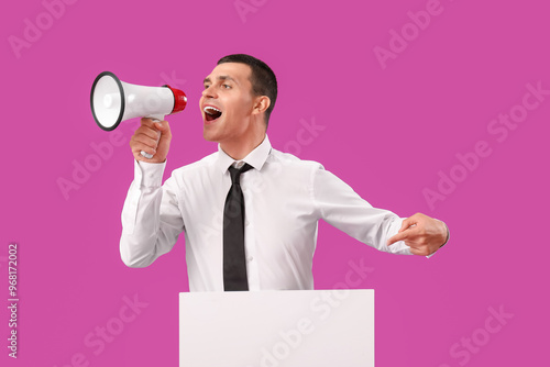 Young man with blank poster...