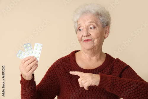 Senior woman pointing at pi...