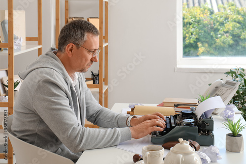 Mature man with scroll and ...