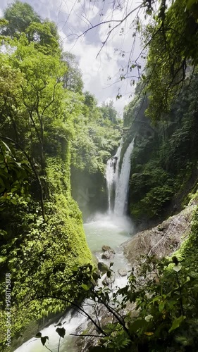 Discover the stunning waterfalls of Bali nestled in lush green jungles during a tranquil afternoon