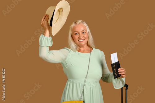 Senior woman with suitcase,...