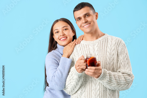 Happy couple with glass of ...