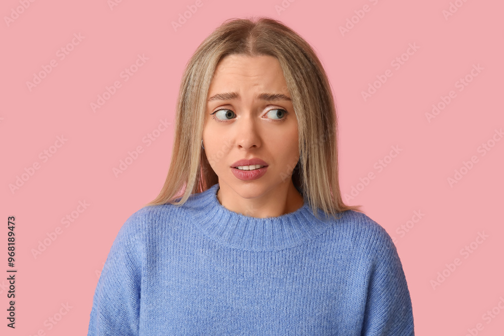 Embarrassed young woman on pink background Embarrassed young woman on pink background
