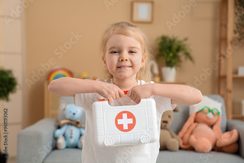 Little girl with toy first ...