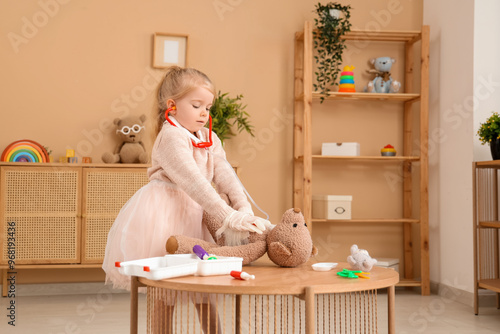 Cute little girl playing do...