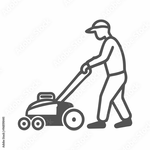 Dedicated gardener mowing grass with a lawnmower in a green garden setting