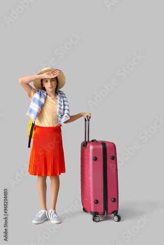 Tired little tourist with s...