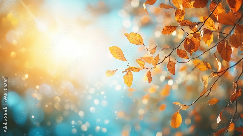 Obraz premium Branch with Autumn Leaves Against a Blurry Background of Light and Bokeh
