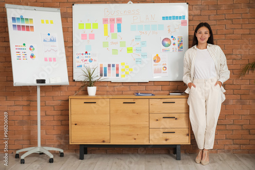 Young Asian woman working o...