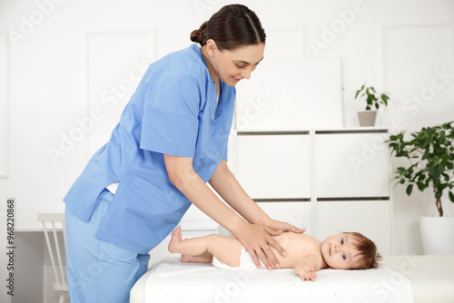 Cute little baby getting be...