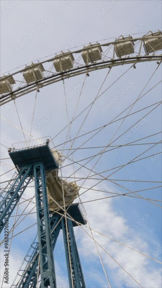 Ferris Wheel In The Sky With Summer Clouds. Vertical. Ferris Wheel In The Sky With Summer Clouds. Vertical.